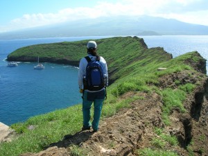 Molokini from island, Maui, HI Don't try this! Access to the land on the island is prohibited - this is a photo of Kim Starr, who, along with her husband Forest, work cataloging the plants and animals of Hawaii and surveying Hawaii's offshore islets. (Photo: Forest and Kim Starr)