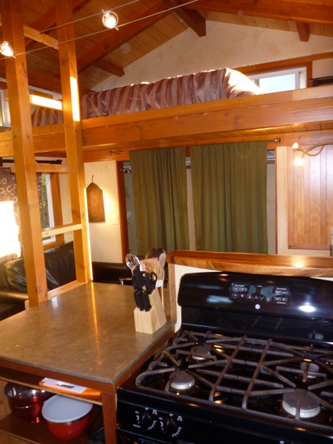 cottage-loft-stove COTTAGE: Stove & Loft ladder in foreground, Living area & couch in background
