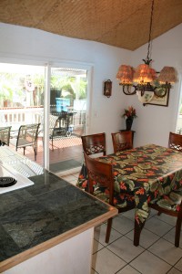 hale-palama-dining-room-from-kitchen Inside and outside dining tables.