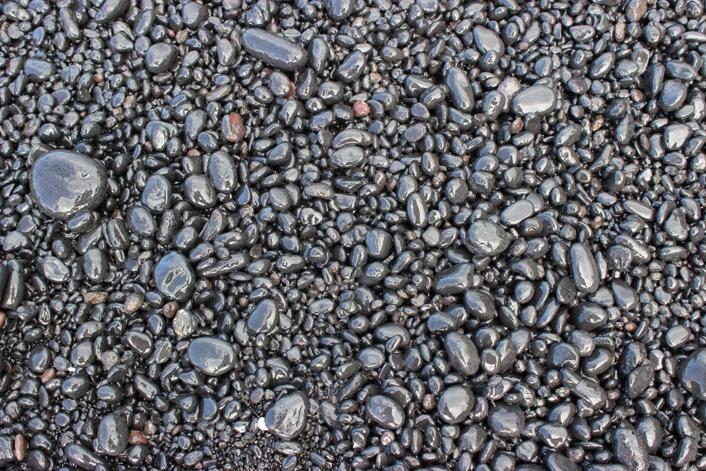 Most of the black sand beach is actually made of black pebbles.